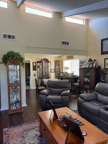 a living room with furniture and lamp