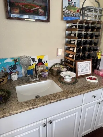 a table with wine bottles and glasses on it