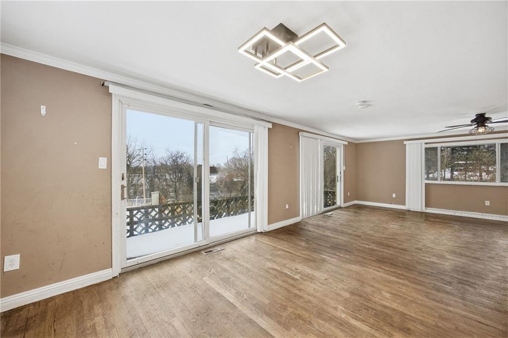3801 Greenfield Road Allison Park, PA 15101 - Photo 13 of 39 an empty room with wooden floor and windows