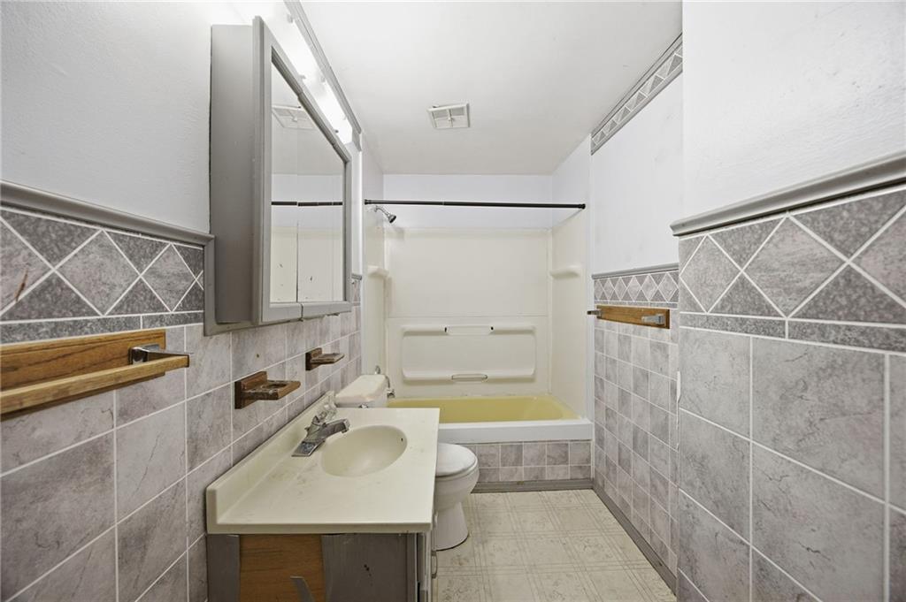 3801 Greenfield Road Allison Park, PA 15101 - Photo 18 of 39 a bathroom with a sink a bathtub and a shower