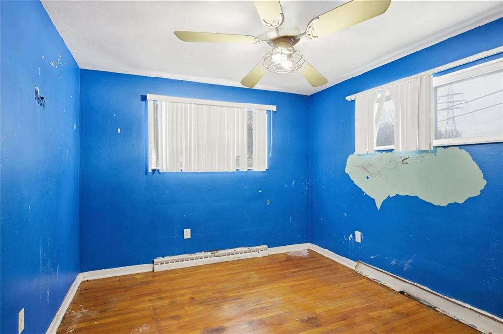 3801 Greenfield Road Allison Park, PA 15101 - Photo 25 of 39 a view of a room with a ceiling fan and wooden floor