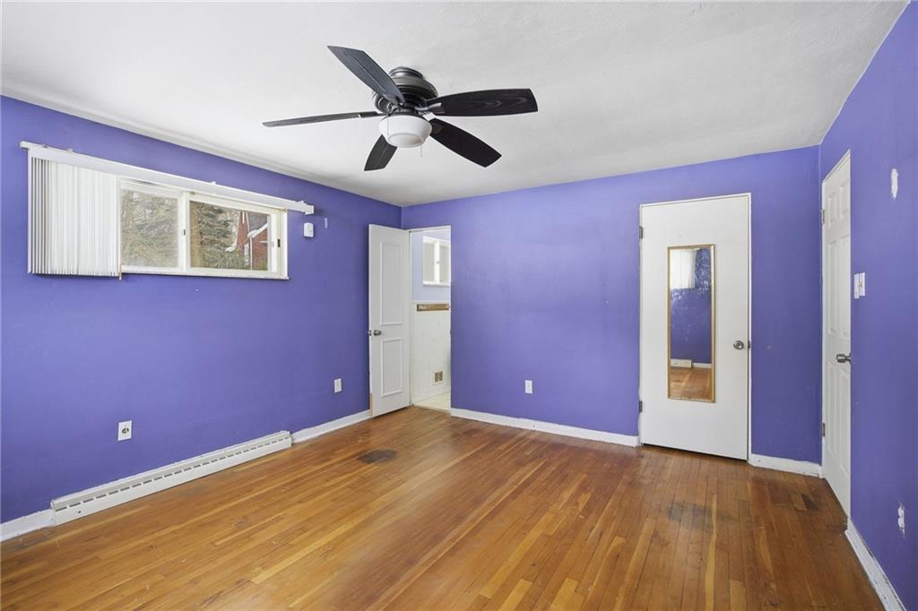 3801 Greenfield Road Allison Park, PA 15101 - Photo 26 of 39 a view of an empty room with wooden floor and a ceiling fan