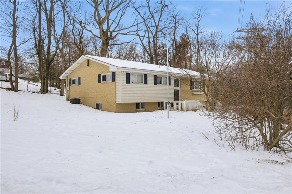 3801 Greenfield Road Allison Park, PA 15101 - Photo 3 of 39 a view of a house with a yard covered with snow in the background