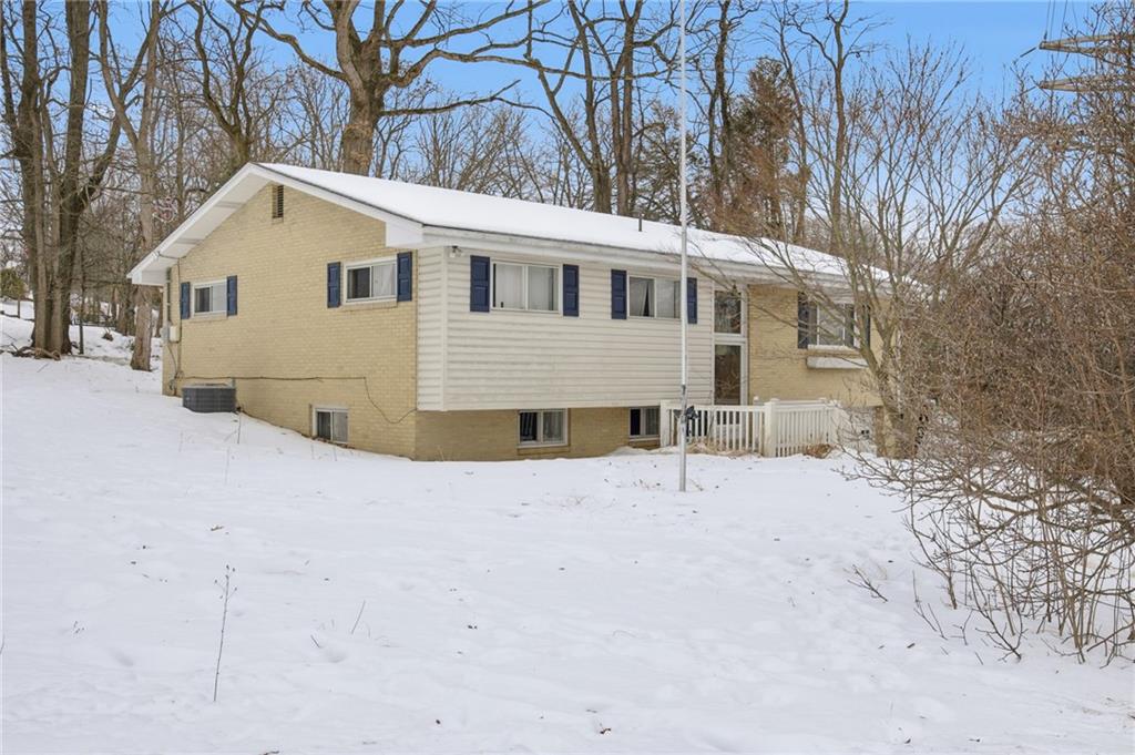 3801 Greenfield Road Allison Park, PA 15101 - Photo 4 of 39 a view of white house with a yard covered in snow