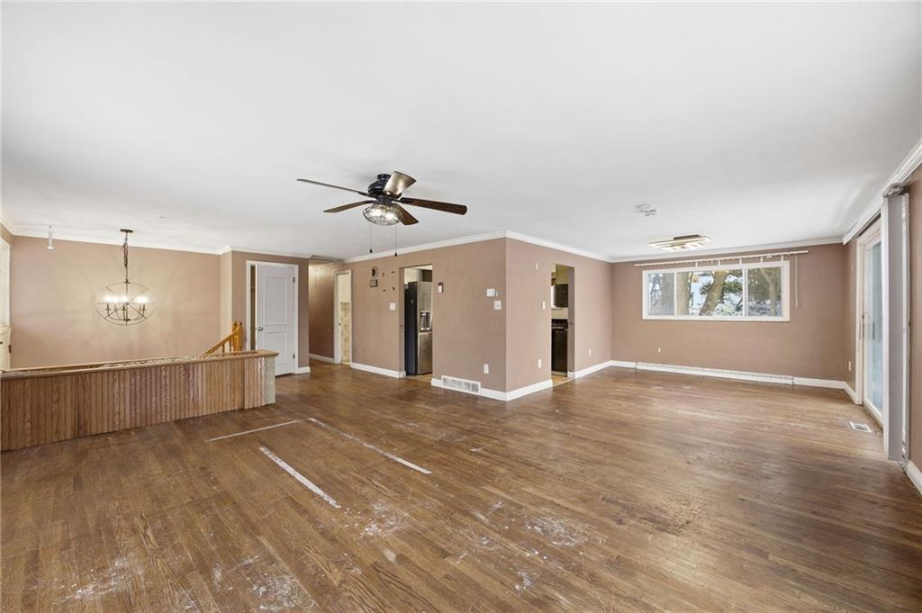 3801 Greenfield Road Allison Park, PA 15101 - Photo 7 of 39 a view of a livingroom with a ceiling fan and window