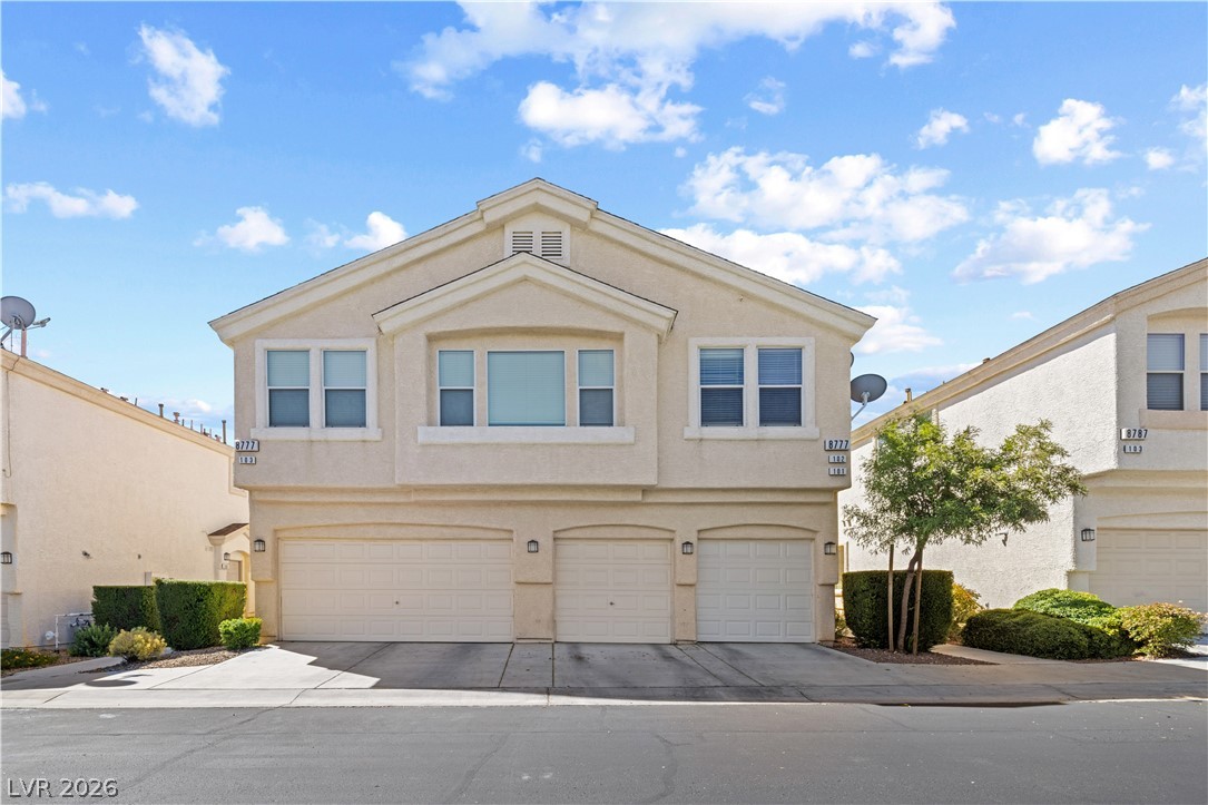 8777 Roping Rodeo Avenue, Unit 101 Las Vegas, NV 89178 - Photo 25 of 25 A well-maintained facade with multiple garages awaits your arrival at this inviting property.
