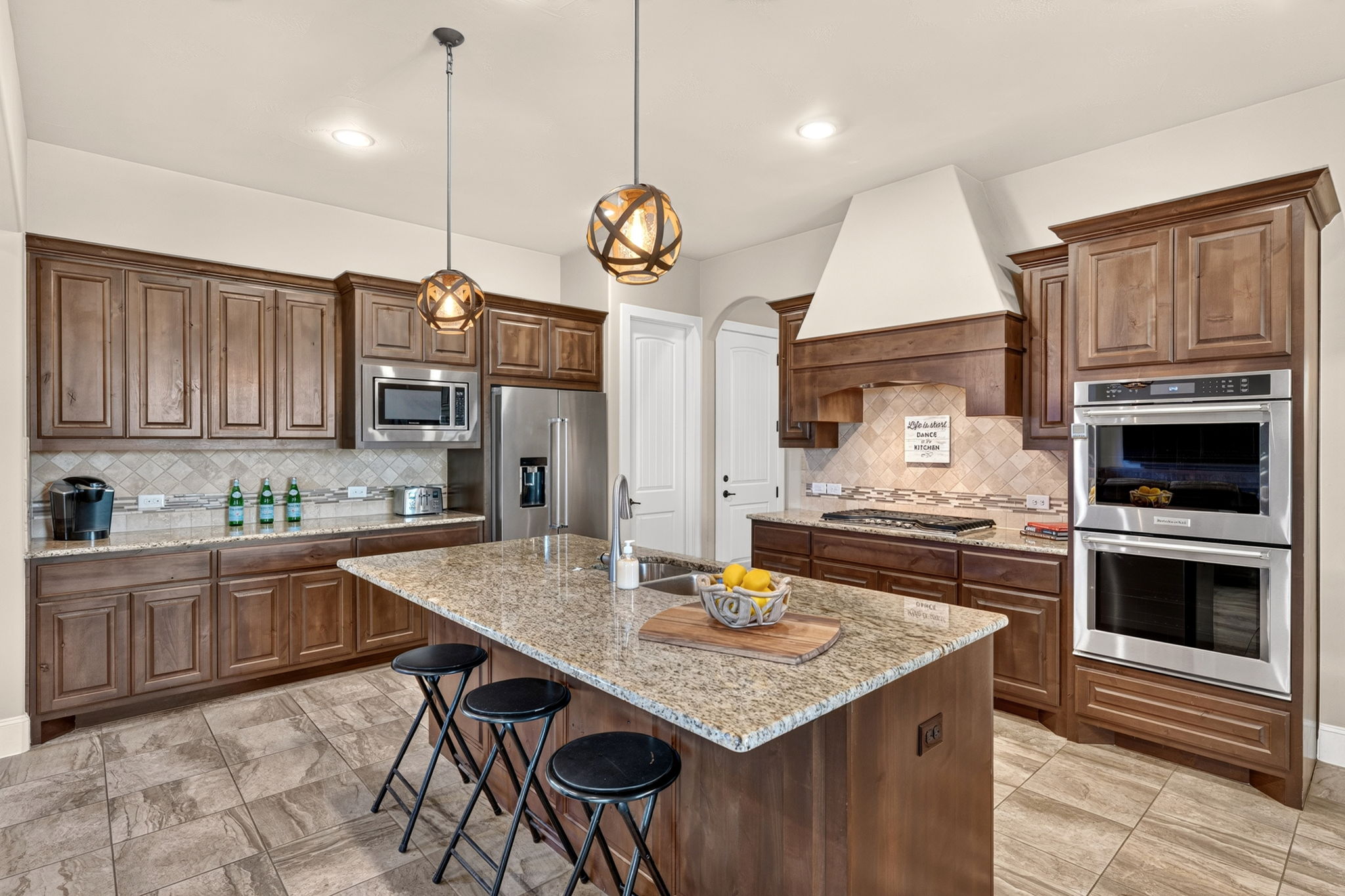 105 Coopers Hill Road Georgetown, TX 78633 - Photo 17 of 40 a kitchen with a table chairs and a stove
