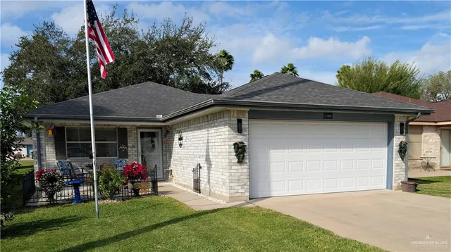 a view of a house with backyard and porch