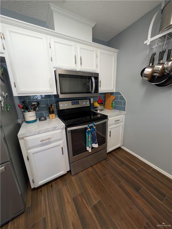 2104 Mockingbird Street Palmview, TX 78572 - Photo 13 of 23 a kitchen with a stove and a microwave