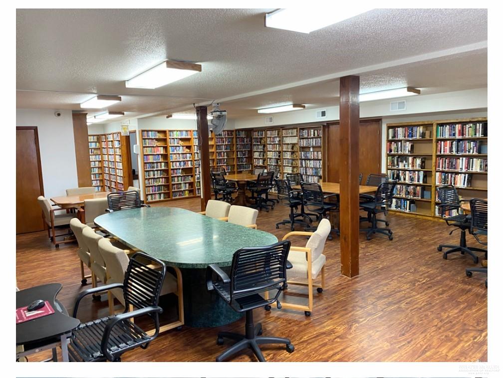 2104 Mockingbird Street Palmview, TX 78572 - Photo 23 of 23 a living room with furniture a rug potted plant and open kitchen view