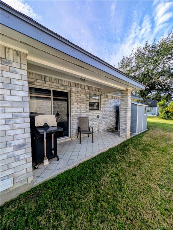 2104 Mockingbird Street Palmview, TX 78572 - Photo 4 of 23 a view of a patio with table and chairs potted plants and a large tree