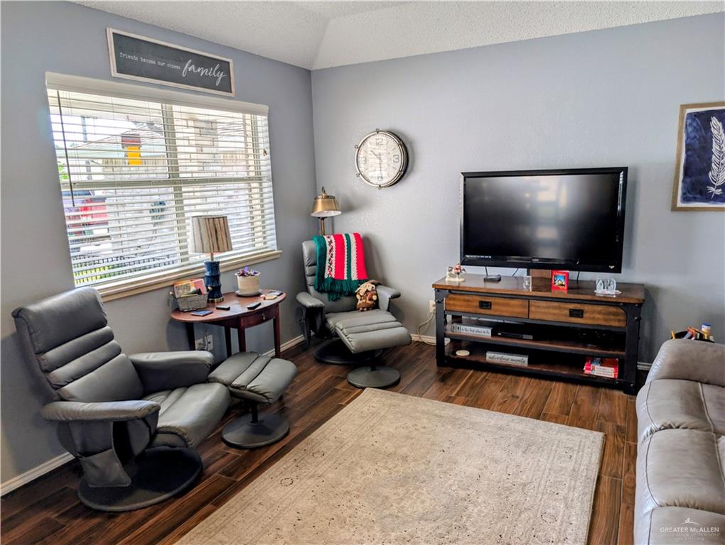 2104 Mockingbird Street Palmview, TX 78572 - Photo 6 of 23 a living room with furniture and a flat screen tv