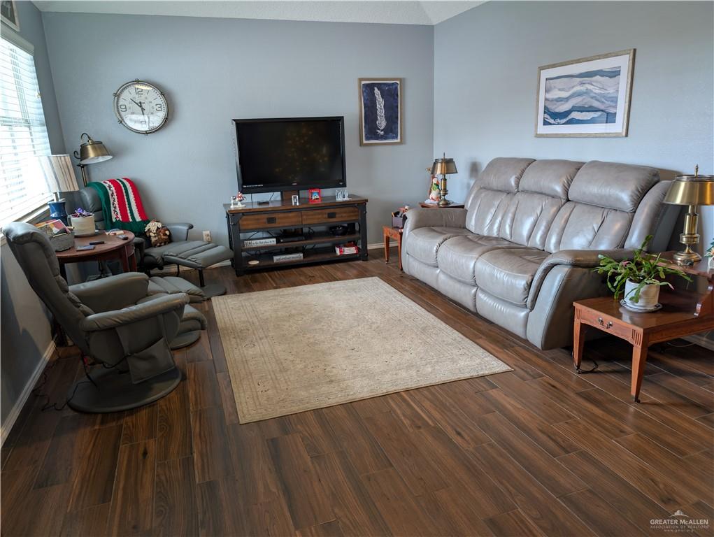 2104 Mockingbird Street Palmview, TX 78572 - Photo 7 of 23 a living room with furniture and a flat screen tv
