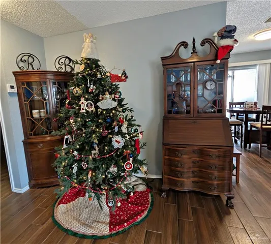 a living room with furniture and a mirror