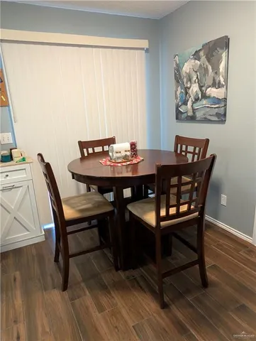 a kitchen with cabinets appliances a sink and a window