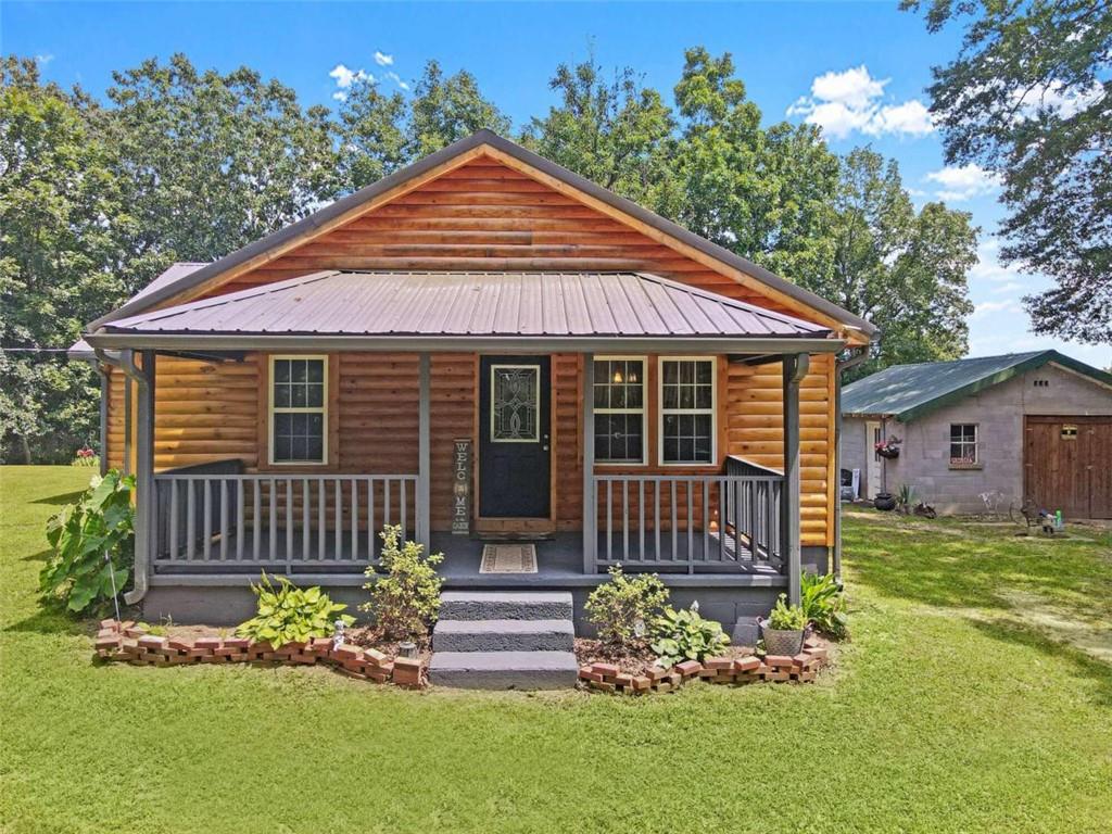 1247 Back Valley Road Lyerly, GA 30730 - Photo 1 of 1 a front view of a house with a garden