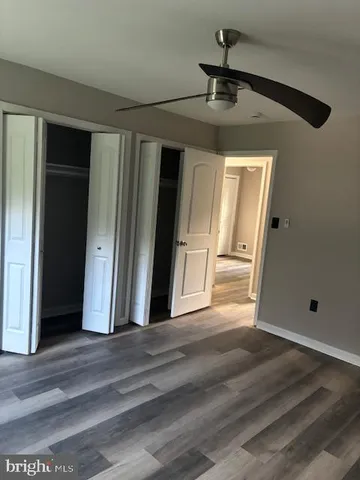 a view of a hallway to a bedroom