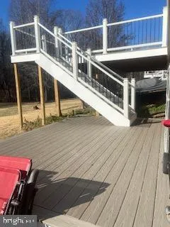 a view of a balcony with furniture