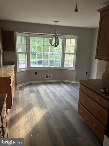 a room with window and walk in closet