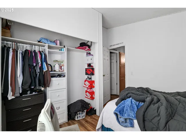 a bed room with a bed and a walk in closet