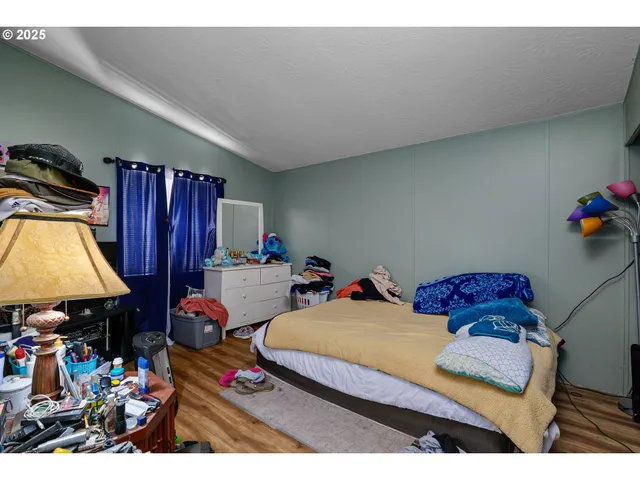 a bedroom with furniture and a baby crib