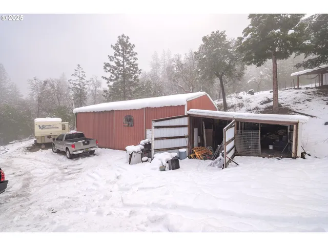 a view of a terrace with chairs and a fire pit