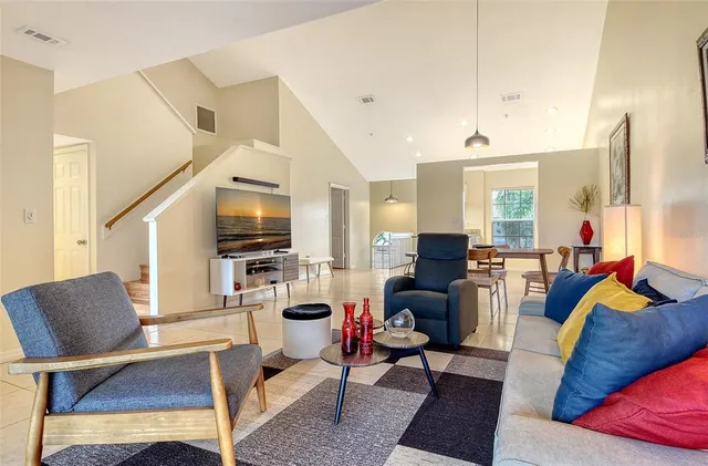 a large kitchen with cabinets table and chairs