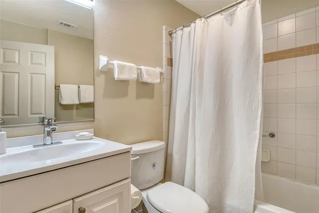 a swimming pool with outdoor seating and yard