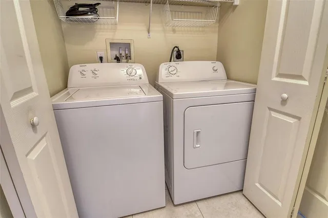 a living room with fireplace furniture and a table