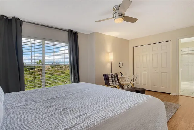a room with pool table and windows