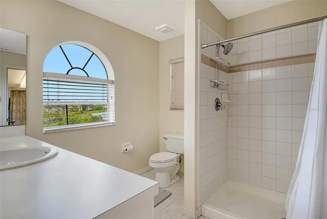 a view of a workspace with furniture and a bookshelf