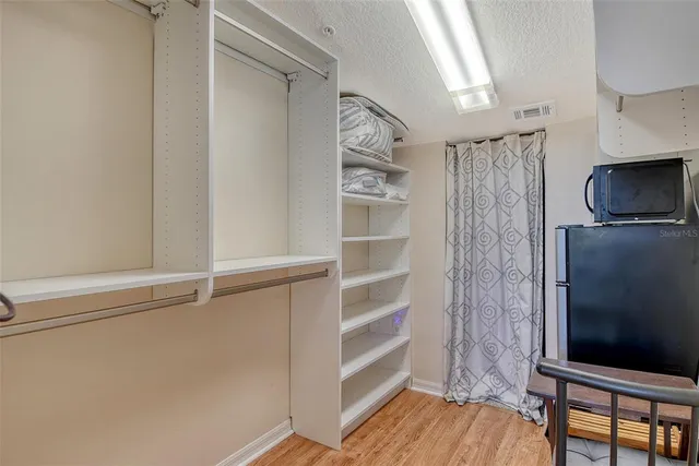 a living room with lots of furniture and a chandelier