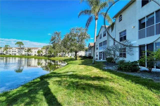 a view of a house with a yard patio and swimming pool