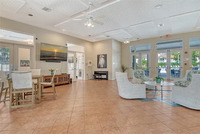 a front view of a house with outdoor seating and barbeque oven