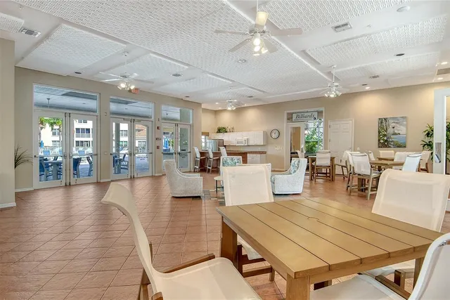 a view of a patio with table and chairs and potted plants