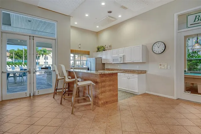 a view of yard with swimming pool and wooden fence