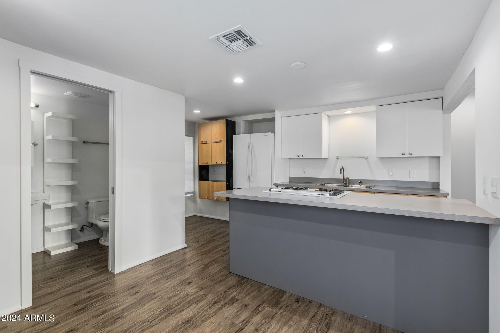 1030 East Polk Street Phoenix, AZ 85006 - Photo 12 of 33 a kitchen with counter top space and sink