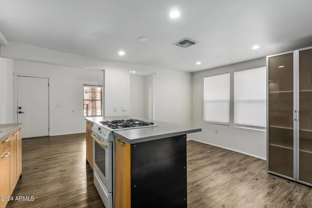 a view of kitchen with furniture and wooden floor