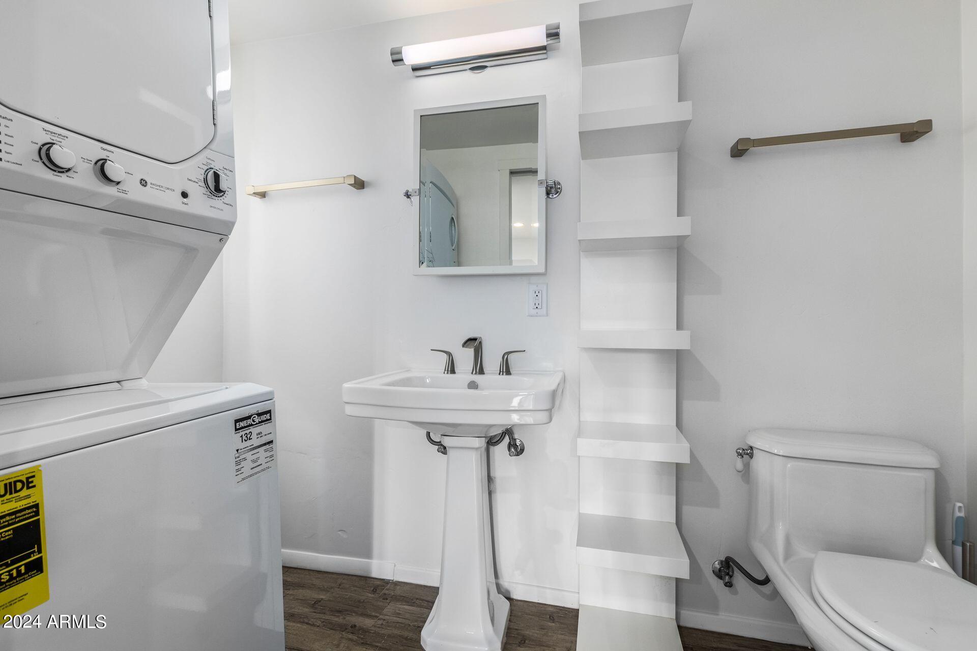 1030 East Polk Street Phoenix, AZ 85006 - Photo 15 of 33 a bathroom with a sink a toilet and shower