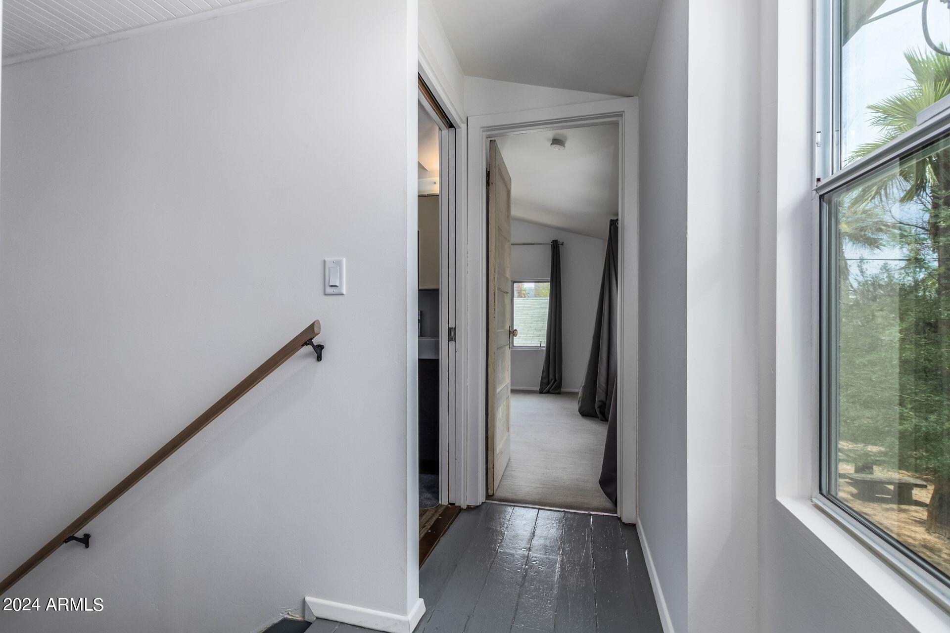 1030 East Polk Street Phoenix, AZ 85006 - Photo 16 of 33 a view of a hallway with wooden floor and staircase