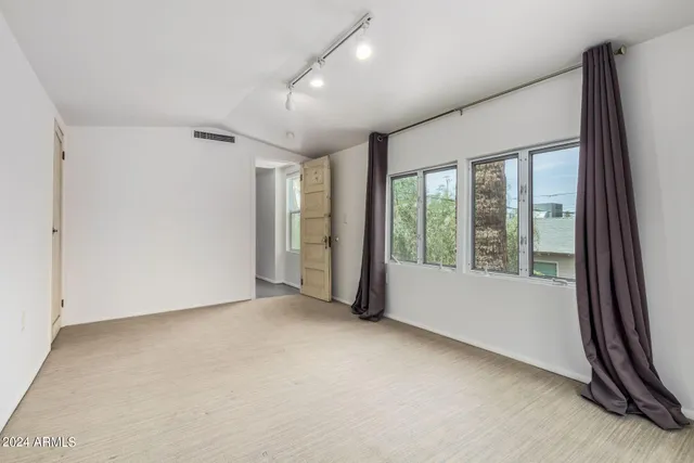 an empty room with windows