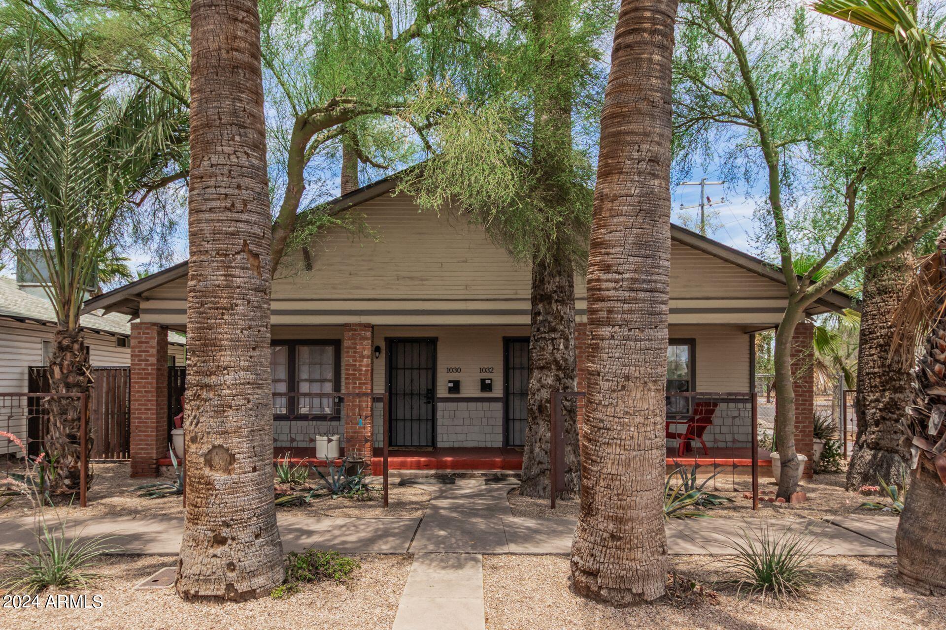 1030 East Polk Street Phoenix, AZ 85006 - Photo 2 of 33 a front view of a house with garden