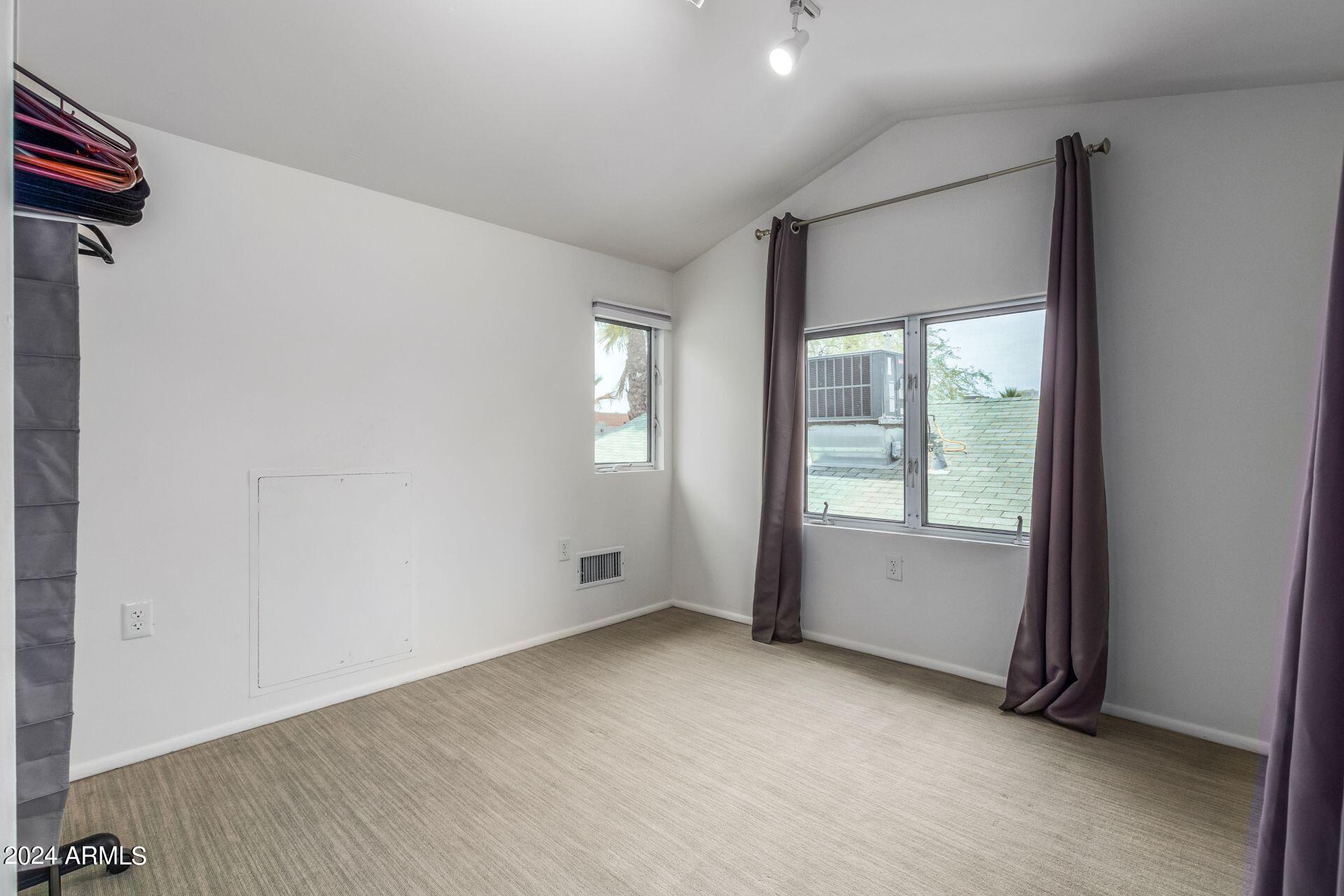 1030 East Polk Street Phoenix, AZ 85006 - Photo 21 of 33 a view of an empty room with a window