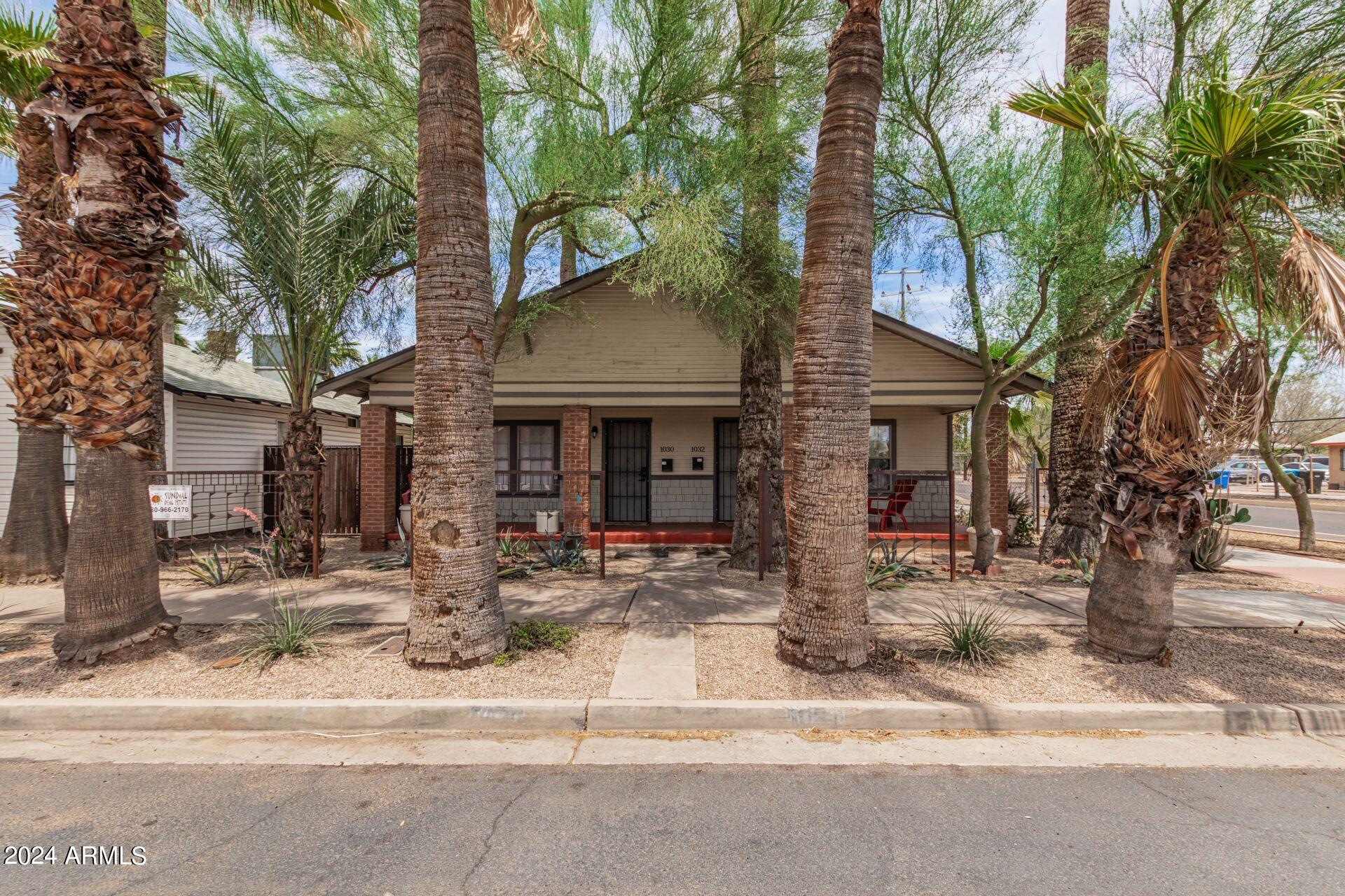 1030 East Polk Street Phoenix, AZ 85006 - Photo 3 of 33 a front view of a house with yard and seating space
