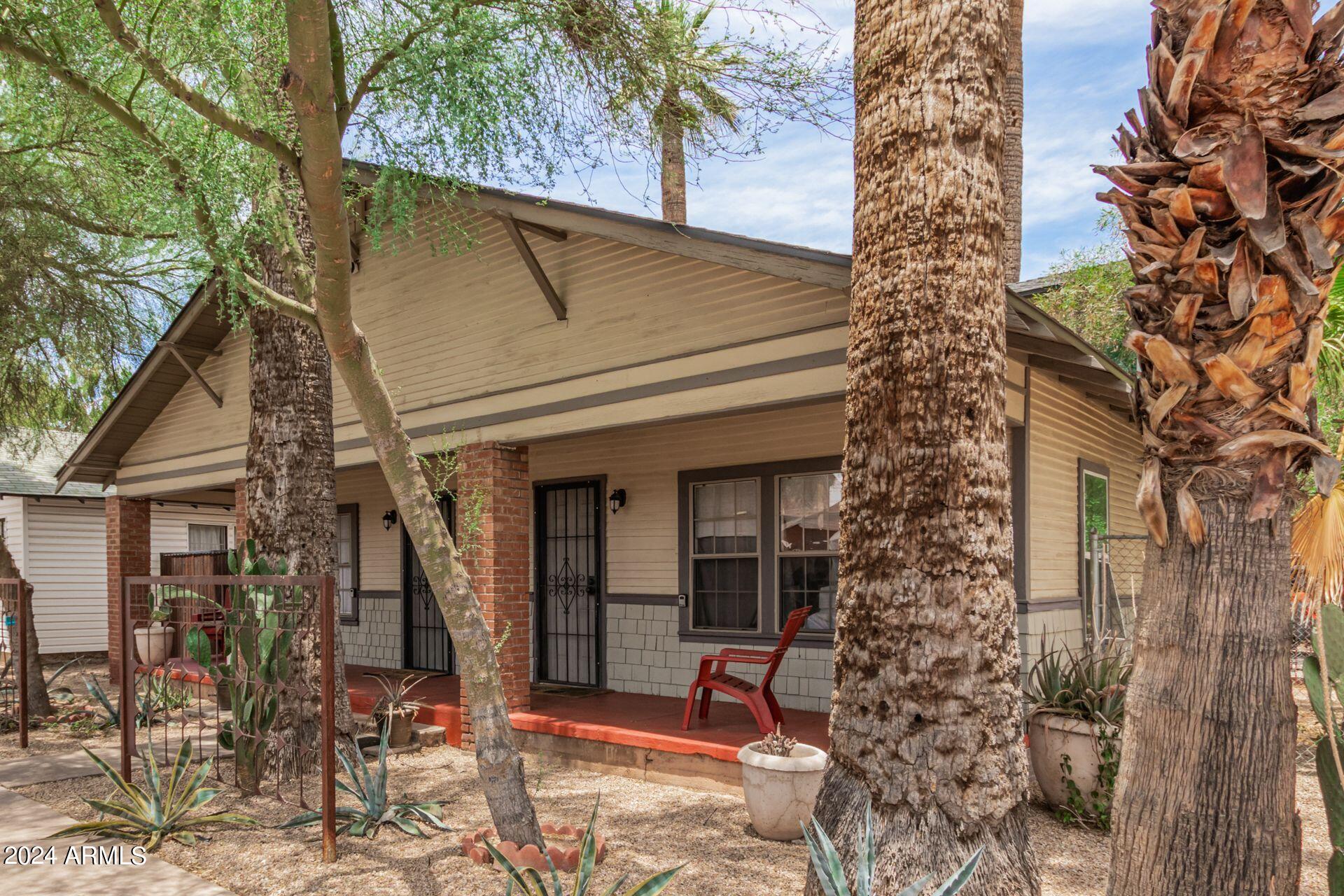 1030 East Polk Street Phoenix, AZ 85006 - Photo 4 of 33 a view of a house with a yard and sitting area