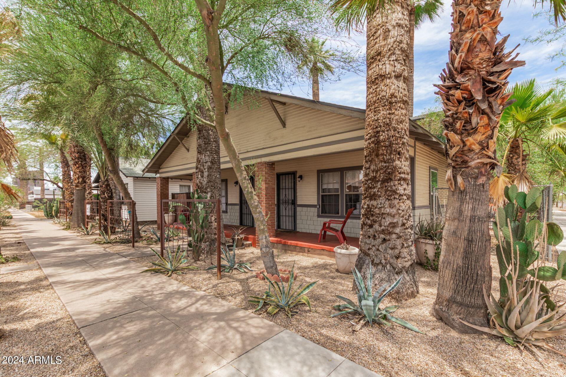 1030 East Polk Street Phoenix, AZ 85006 - Photo 5 of 33 a view of a house with a tree in the background