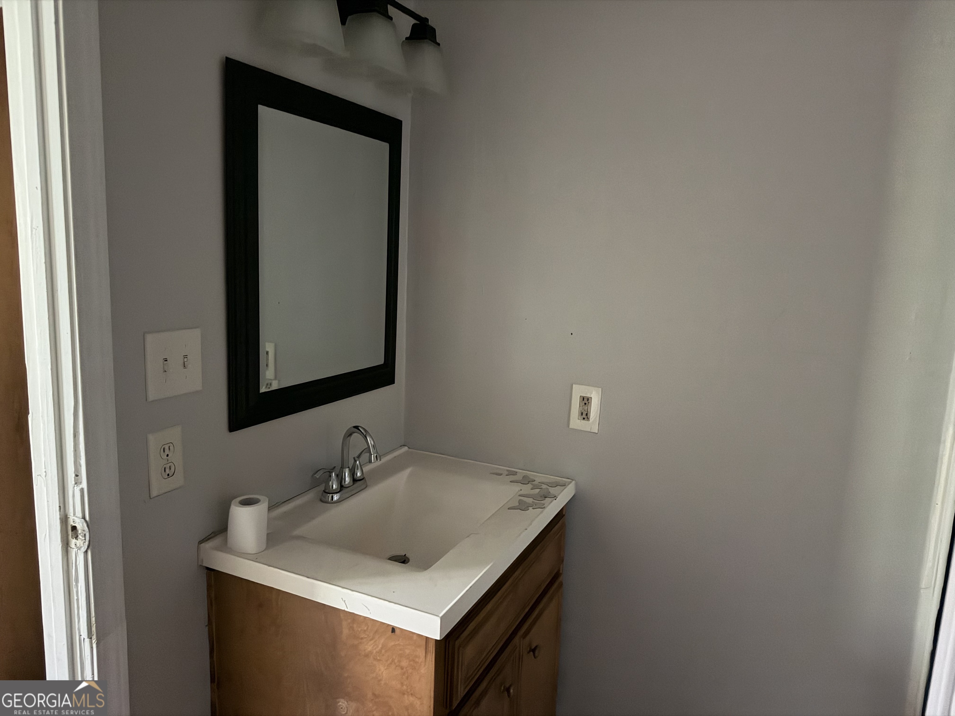 114 A Street Northeast Thomaston, GA 30286 - Photo 11 of 11 a bathroom with a sink and a mirror