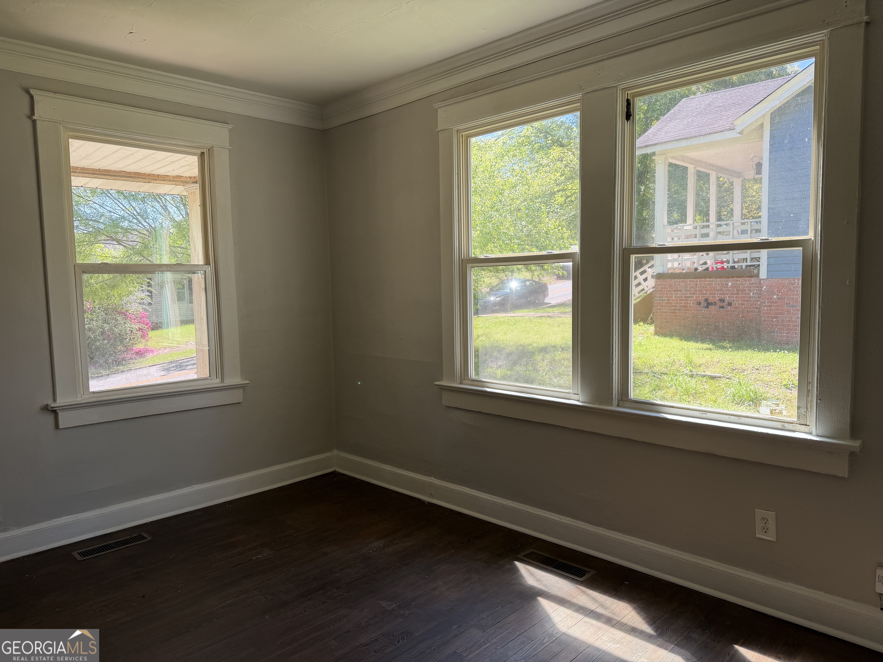 114 A Street Northeast Thomaston, GA 30286 - Photo 8 of 11 a view of an empty room with wooden floor and a window