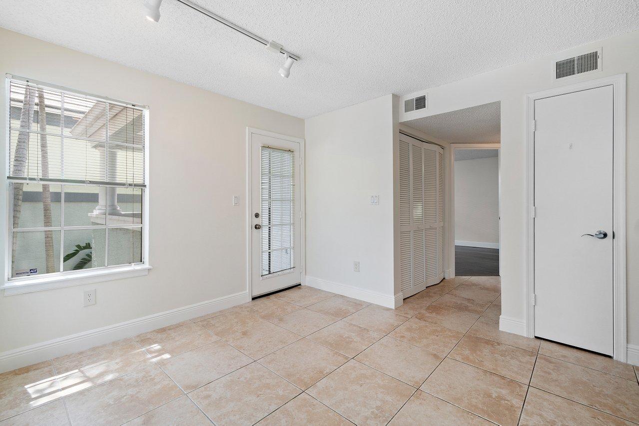 1275 Crystal Way, Unit B Delray Beach, FL 33444 - Photo 12 of 37 a view of an empty room with a window