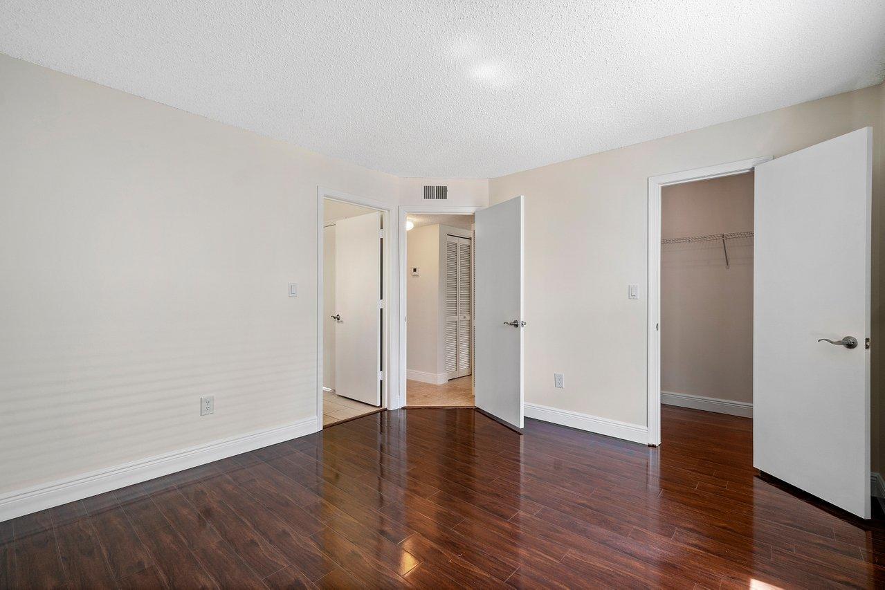 1275 Crystal Way, Unit B Delray Beach, FL 33444 - Photo 24 of 37 wooden floor in an empty room